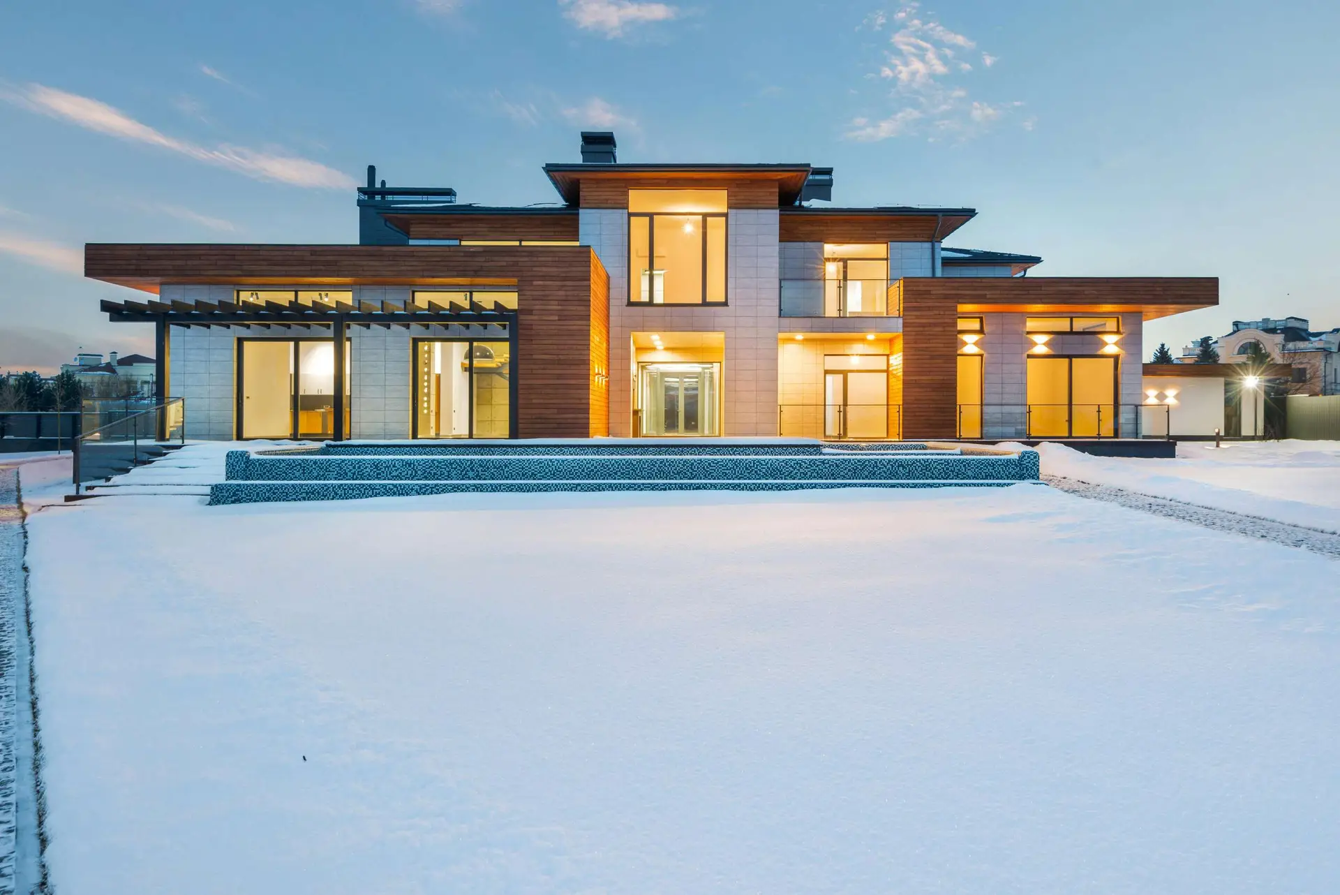 Suburban rental home in New Jersey with snow on roof and lawn, ready for winter maintenance.